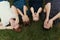 Portrait family with kids lying on the grass