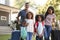 Portrait Of Family With Luggage Leaving House For Vacation