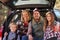 Portrait of family by their car before hiking, close-up