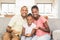 Portrait of a family of three watching tv