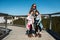 Portrait of family visiting wooden treetop observation deckwalkway