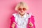 Portrait of fancy aged lady in eyeglasses posing at camera