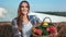 Portrait of farmer female posing with basket full of fresh vegetables. Medium shot on RED camera