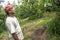 portrait of farmer on peaches fruit orchard