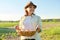 Portrait of farmer woman in hat with basket of fresh egg