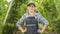 Portrait of a farmer woman near a well-kept garden