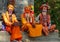 PORTRAIT: Fascinating yogis in Pashupatinath Temple sitting on a concrete ledge.