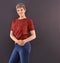 Portrait, fashion and elderly woman with smile, retirement and confident pensioner on a grey studio background. Face