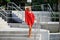 Portrait of fashionable girl in red dress