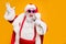 Portrait of fat big belly crazy funky santa claus hold microphones have live x-mas performance sing carols on christmas