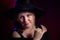 Portrait of fat plump chubby middle-aged woman with hat and black dress. Model looking as lady posing in studio