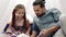 Portrait of father and daughter playing at home