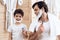 Portrait of father and son with razors which shaving in bathroom.