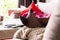 A portrait of the feet of a woman in black nylon pantyhose or stockings lying on a couch in a living room with her legs crossed on