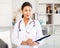 Portrait of female asian therapist with folder for papers