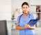 Portrait of female asian therapist with folder for papers