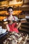 Portrait of female baker holding a tray of sweet foods