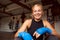 Portrait Of Female Boxer With Protective Wraps On Hands Training In Gym