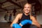 Portrait Of Female Boxer With Protective Wraps On Hands Training In Gym