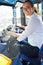 Portrait Of Female Bus Driver Behind Wheel