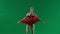 Portrait of female on chroma key green screen background. Close up shot ballerina in red tutu and dark body showing