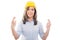 Portrait of female constructor holding fingers crossed