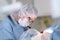 Portrait of a female dentist in surgical uniform