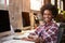 Portrait Of Female Designer Working At Desk In Modern Office