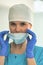 Portrait of female doctor removing surgical mask at clinic