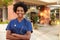 Portrait Of Female Doctor Standing Outside Hospital