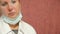 Portrait of female doctor tired after work ,taking off her protective medical mask and sighing wearily.Hard work of doctors in the