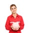 Portrait of female emergency doctor with piggy bank