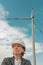 Portrait of female engineer on modern wind turbine farm