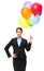 Portrait of female executive keeping colorful balloons