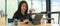 Portrait of female freelancer working with digital tablet on worktable