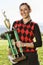 Portrait of Female Golf Champion Holding Trophy