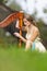 Portrait of Female Harpist Woman in Light Dress Playing the Harp  In Park Outdoor