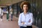 Portrait Of Female High School Or Secondary School Teacher Outdoors At School