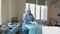 Portrait of female medical worker in protective mask preparing for surgery. Surgical instrument. Preparation for surgery