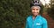 Portrait of female mountain biker with bike