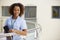 Portrait Of Female Nurse With Digital Tablet In Hospital