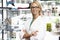 Portrait Of Female Optician By Glasses Display