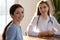 Portrait of female patient having consultation with doctor