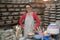 Portrait of female potter standing near worktop