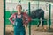 Portrait of female rancher at horse stable looking at camera