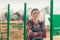 Portrait of female rancher at horse stable looking at camera