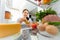 Portrait of female standing near open fridge full of healthy food. Portrait of female