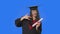 Portrait of female student in cap and gown graduation costume, holding diploma and making rock gesture. Young woman