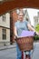 Portrait Of Female Student Riding Old Fashioned Bicycle Around Oxford University College Buildings By Bridge Of Sighs