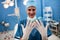 Portrait of female surgeon showing surgical gloves in operation room